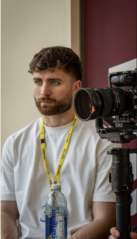 Jaymes Croft filming on set with a camera rig