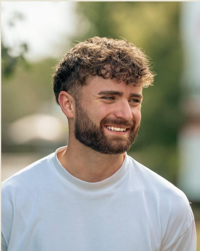 Jaymes Croft smiling outdoors